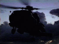HH-60J Airborne at night, underway, no lights.